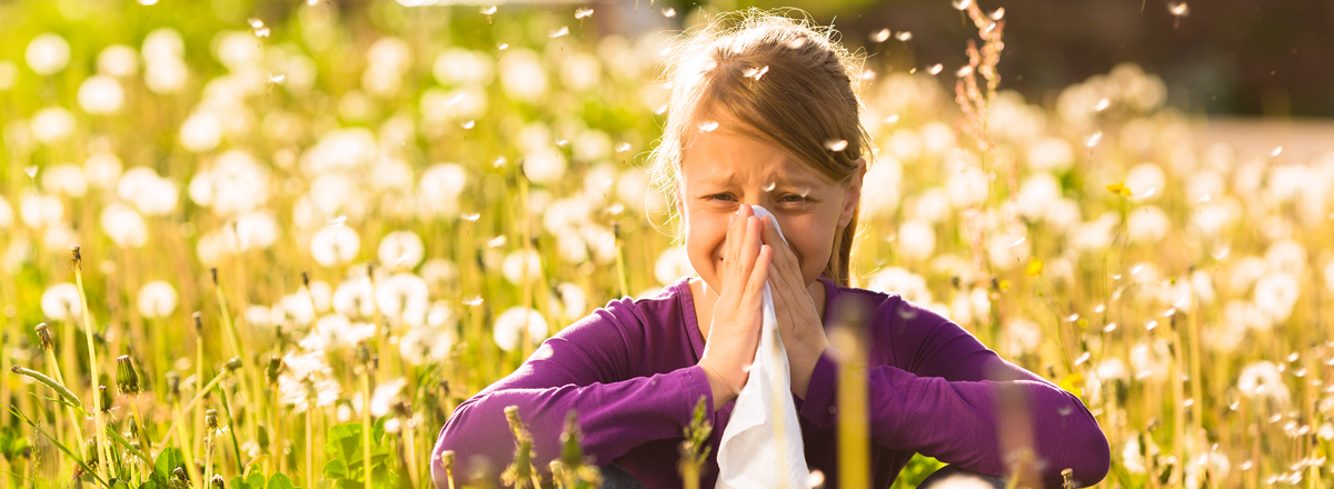 Girl-sitting-in-a-meadow-with-37087252-crop1